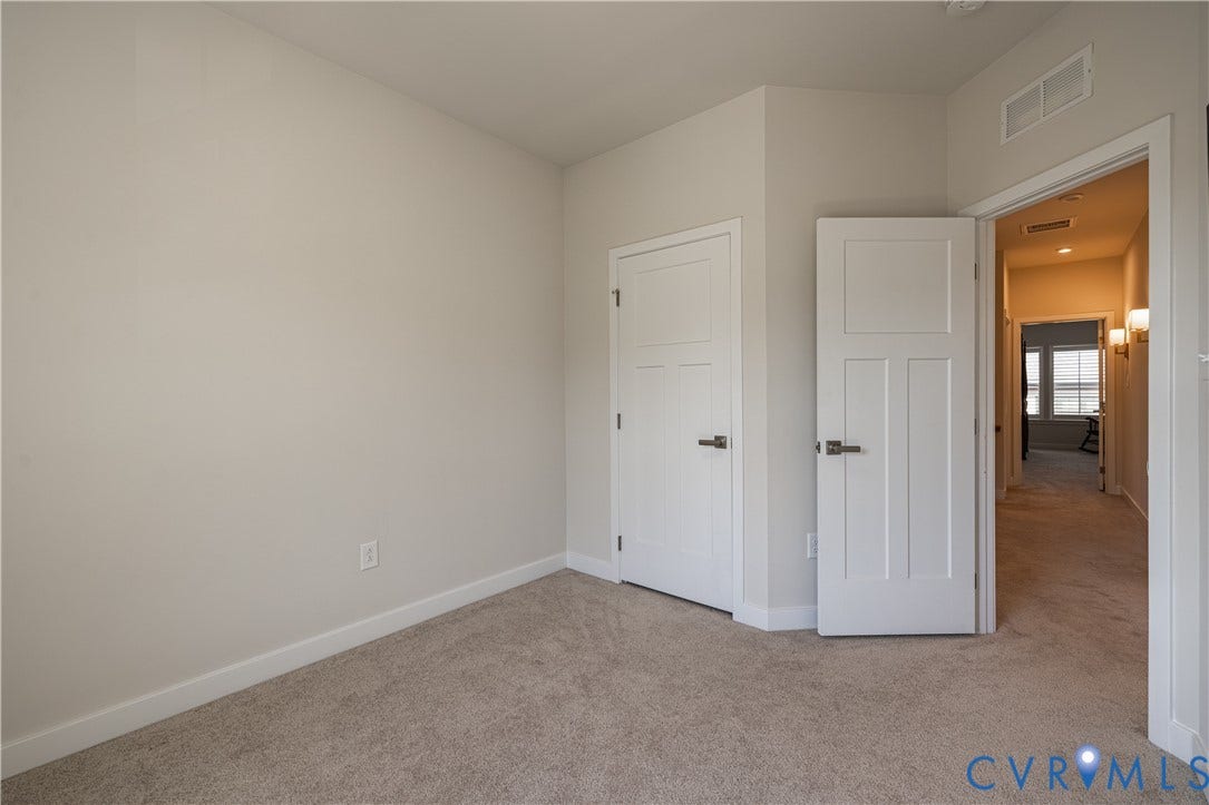 14336 Altavista Boulevard, Midlothian, VA 23114 Neutral paint palette with carpeting, white trim, and white doors featuring dark hardware