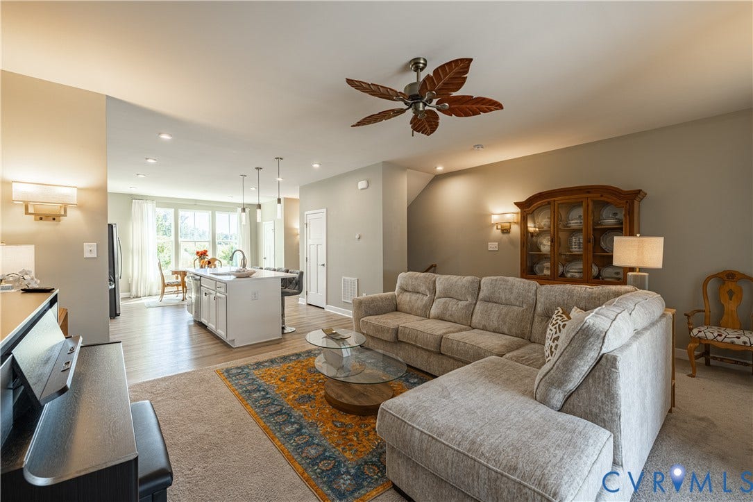 14336 Altavista Boulevard, Midlothian, VA 23114 Open-concept living area with recessed lighting, a ceiling fan, and wall sconces