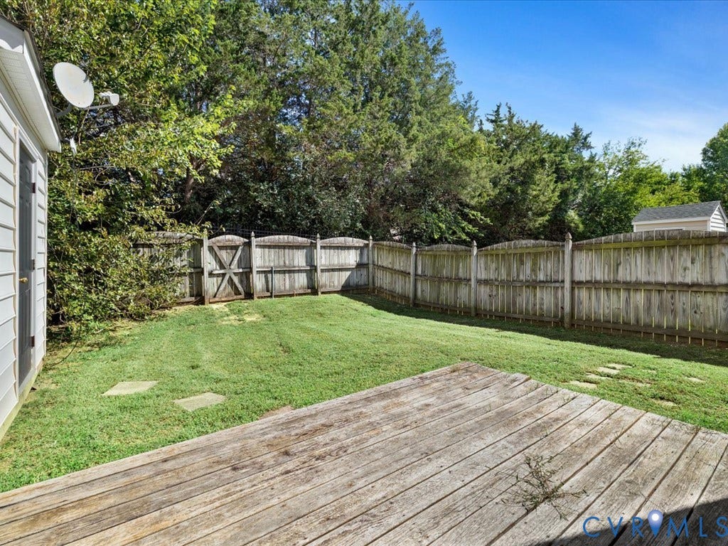 Wood deck with a green lawn