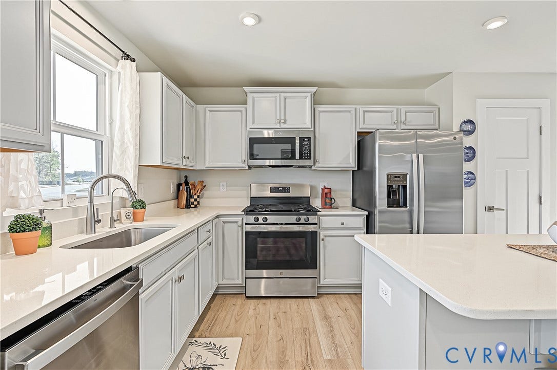 7490 E Danube Loop, The Groves, New Kent, VA 23124 Well-appointed kitchen with abundant cabinetry and an open connection to the living room