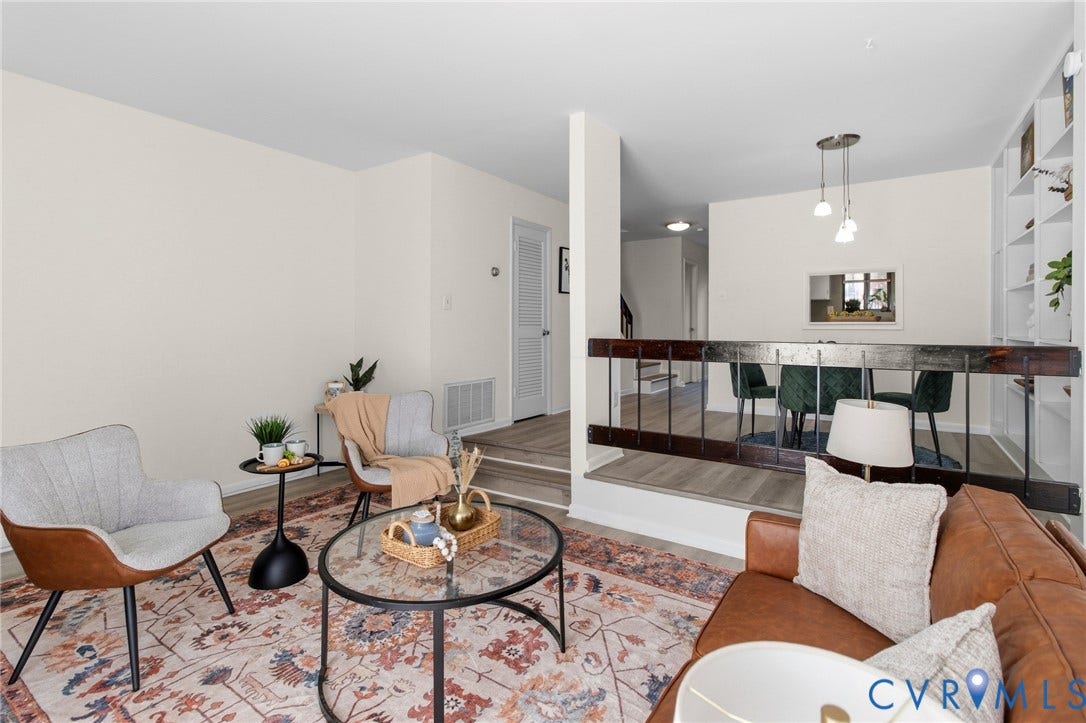 Hard-surface flooring, built-in shelving, half-wall with wood railing, recessed lighting, and a pass-through window