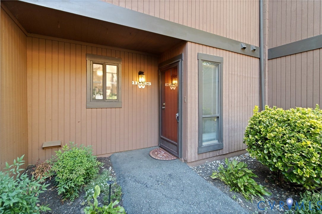 Vertical wood siding with dark trim accents