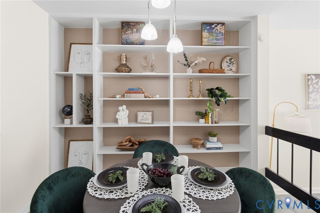 Built-in shelving unit with multiple display levels and a contrasting back panel