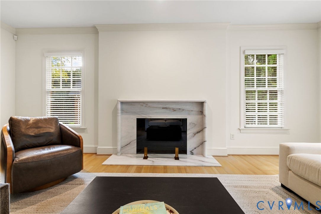 3808 Barrington Branch Court, Henrico, VA 23233 Marble-surround fireplace with a dark firebox, hardwood flooring, and white window blinds