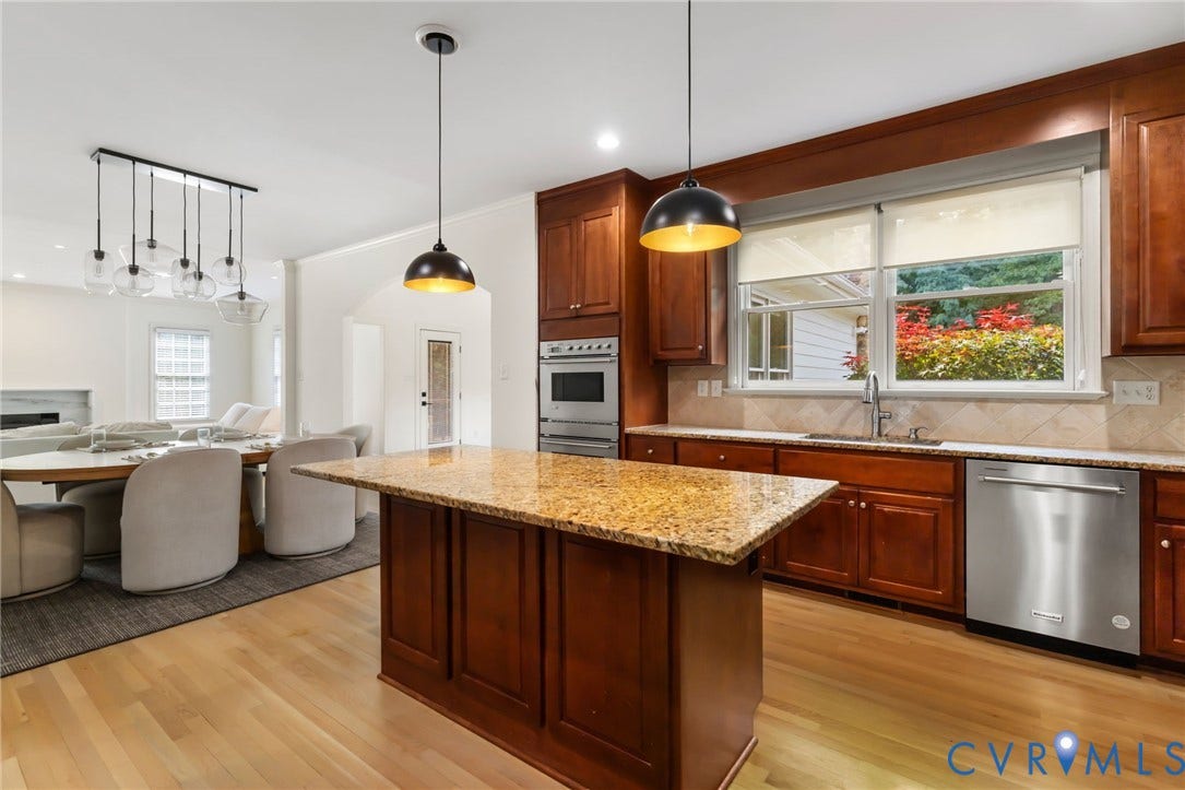 3808 Barrington Branch Court, Henrico, VA 23233 Kitchen featuring an island with a stone countertop, wood cabinetry, stainless steel appliances, and wood-finish flooring