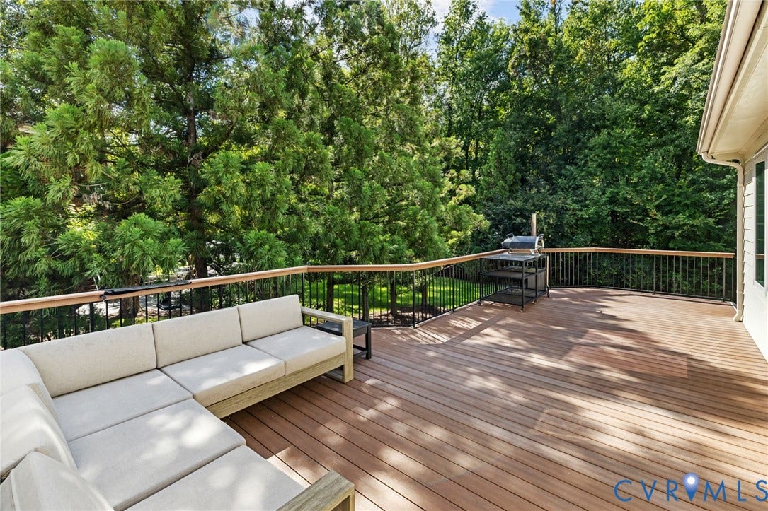 3808 Barrington Branch Court, Henrico, VA 23233 Expansive deck featuring composite decking, black metal balusters, and a wood-finish top rail