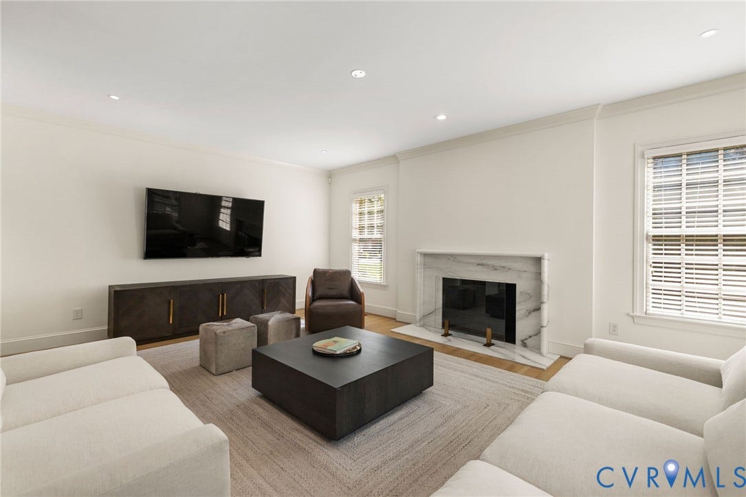 3808 Barrington Branch Court, Henrico, VA 23233 Recessed lighting, crown molding, wood-finish flooring, white walls, and a fireplace with a stone surround
