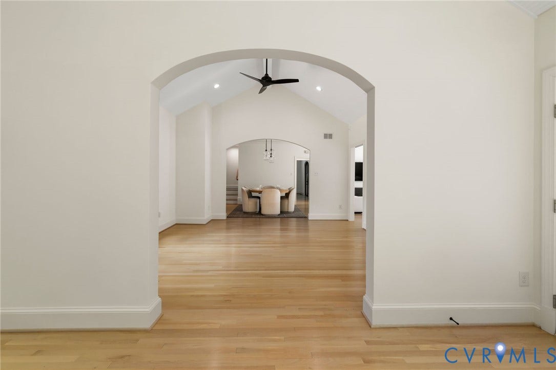 3808 Barrington Branch Court, Henrico, VA 23233 Arched entryway leading to a room with wood-finish flooring, vaulted ceiling, and recessed lighting