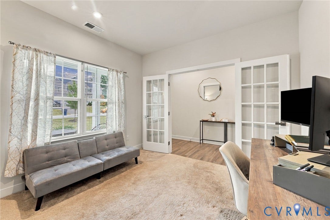 French doors opening to an adjacent room, wood-finish flooring, recessed lighting, and a window with blinds