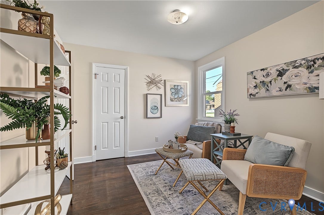 Flexible living space with fresh neutral finishes, wood floors, and a bright, welcoming atmosphere