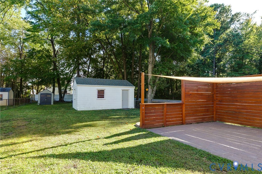 Fully fenced backyard with lawn space and patio for outdoor seating or entertaining