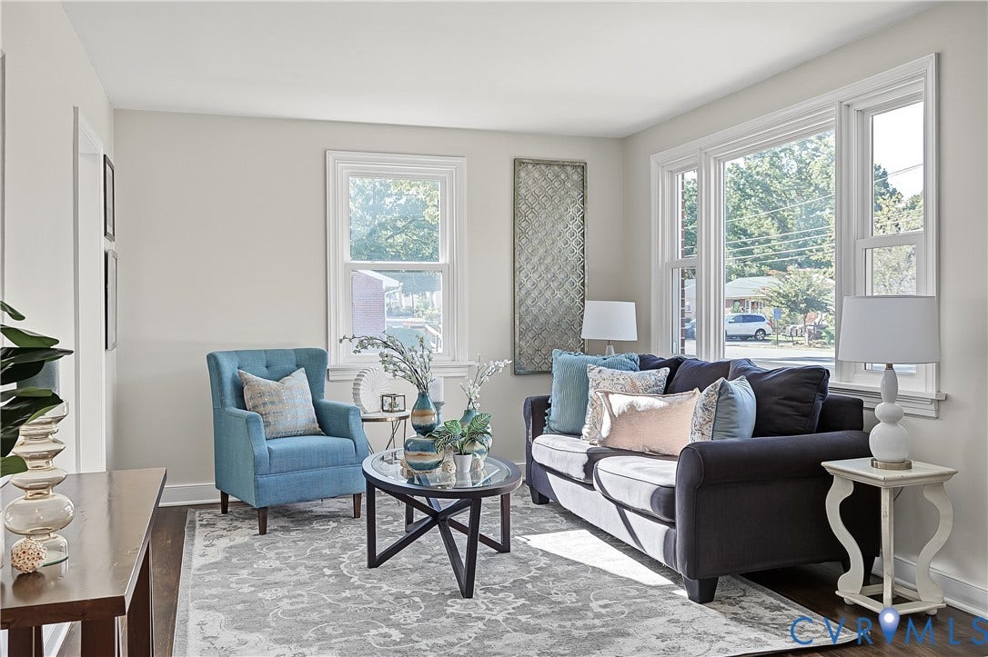 Bright living room featuring hardwood floors and picture window