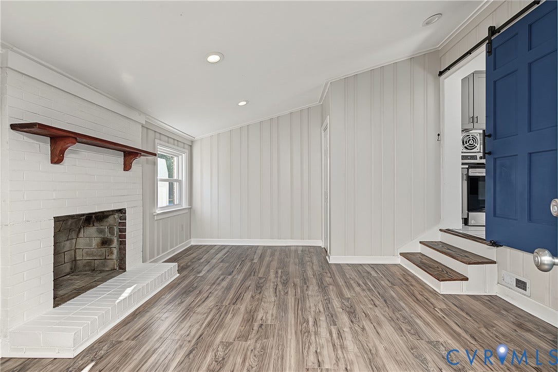 Versatile family room with a traditional fireplace and room for a media area or lounge