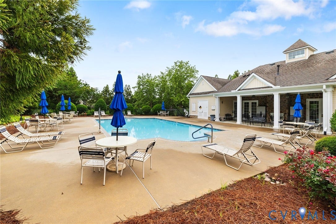 251 Pumpkin Place, Harvest Glen, North Chesterfield, VA 23236 Expansive pool deck with an in-ground swimming pool, surrounded by mature trees and landscaping