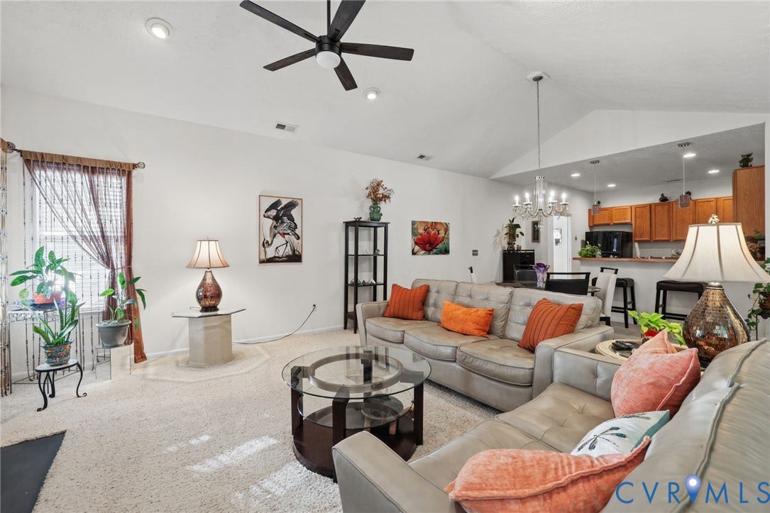251 Pumpkin Place, Harvest Glen, North Chesterfield, VA 23236 Open-concept living space featuring a gray upholstered sectional sofa, round glass-top cocktail table, recessed ceiling lighting, and a ceiling fan