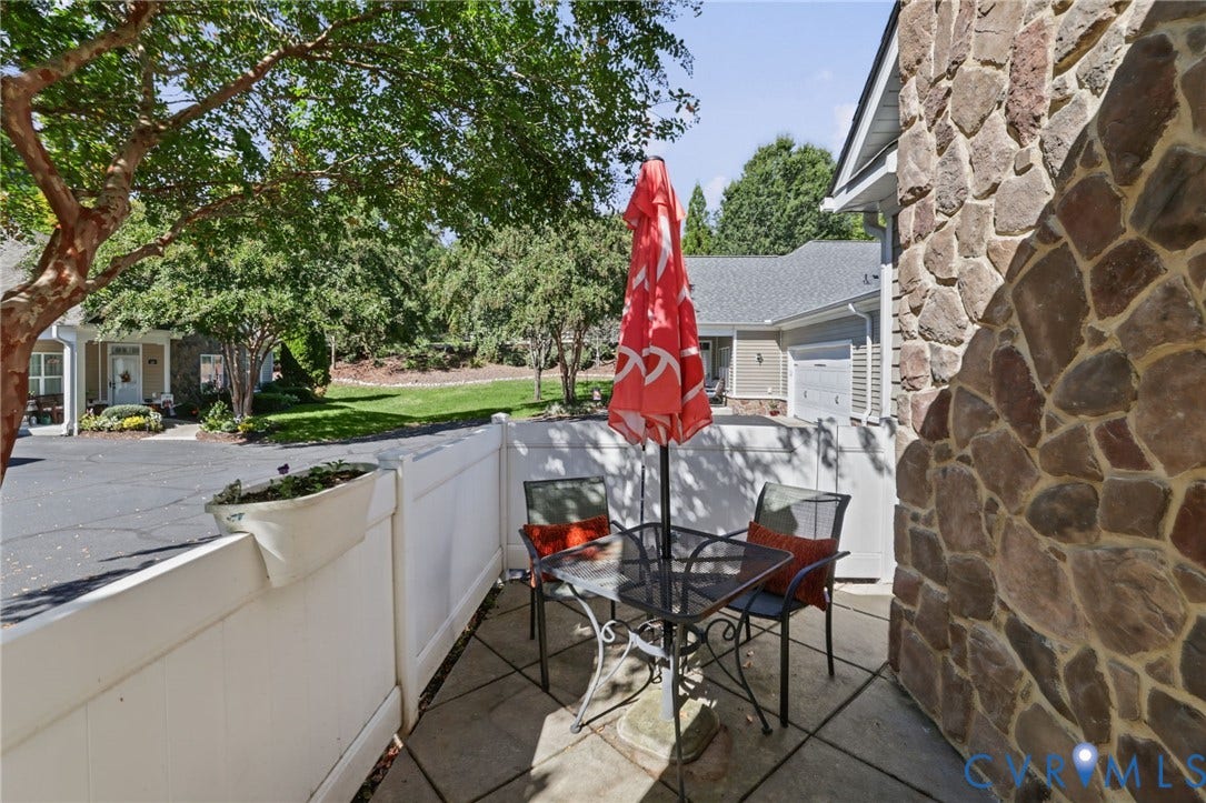 251 Pumpkin Place, Harvest Glen, North Chesterfield, VA 23236 Private patio with stone-finish exterior wall, white privacy fence, and paved surface