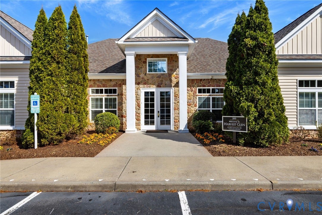 251 Pumpkin Place, Harvest Glen, North Chesterfield, VA 23236 Stone facade with siding accents, gabled entryway, double-pane windows, and a paved walkway