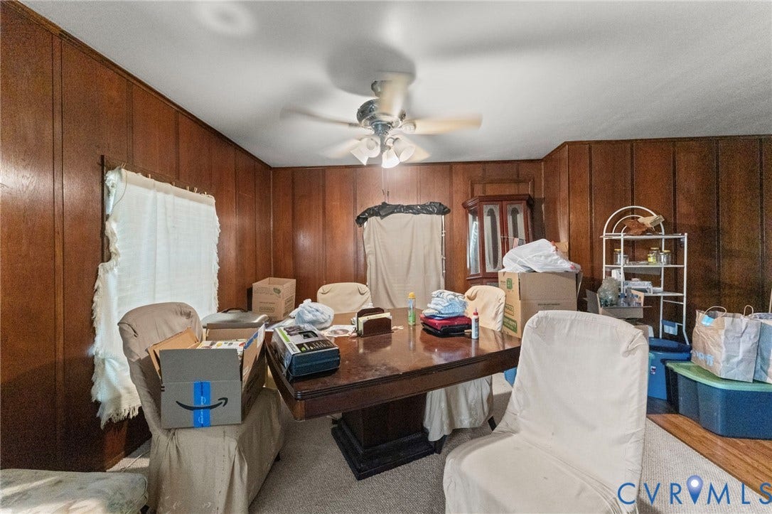 3917 Peyton Avenue, Richmond, VA 23224 Room featuring wood-paneled walls, carpeted flooring, and a ceiling fan with integrated lighting