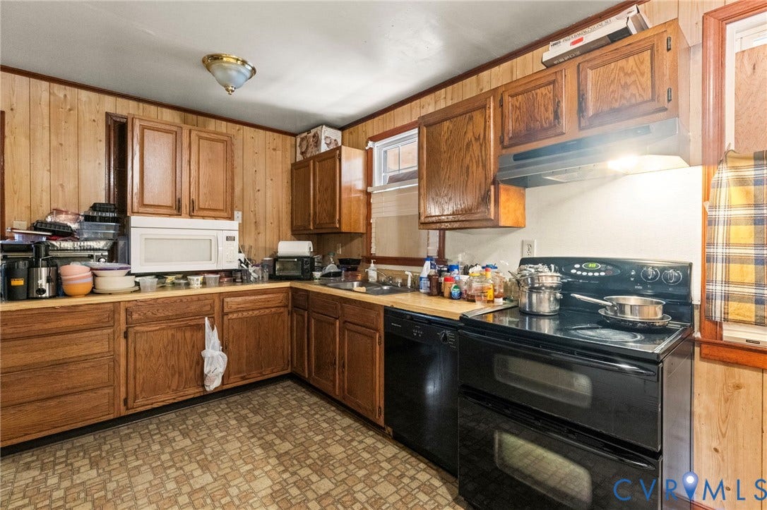 3917 Peyton Avenue, Richmond, VA 23224 Wood-panel walls, wood cabinetry, and wood-finish countertops