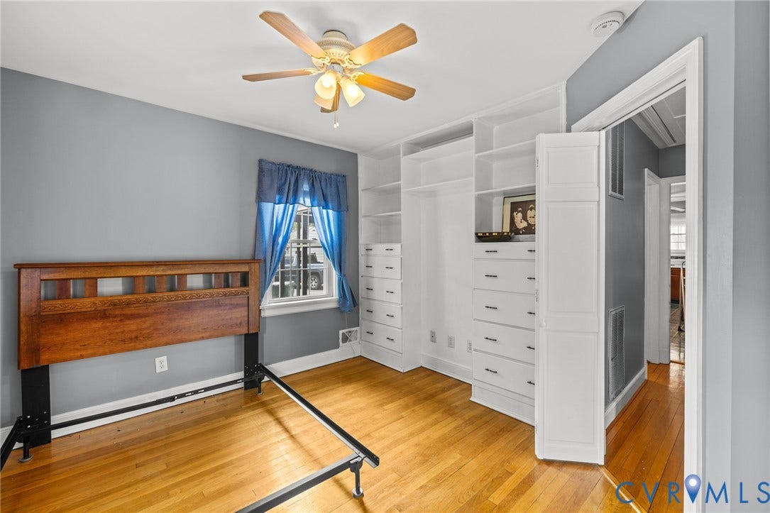 2405 Dumbarton Road, Henrico, VA 23228 Hardwood flooring, ceiling fan with integrated lighting, built-in storage with shelving and drawers, and a window for natural light