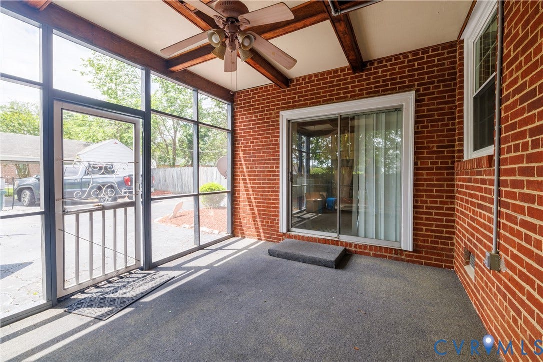 2405 Dumbarton Road, Henrico, VA 23228 Screened porch with exposed wood beams and a ceiling fan