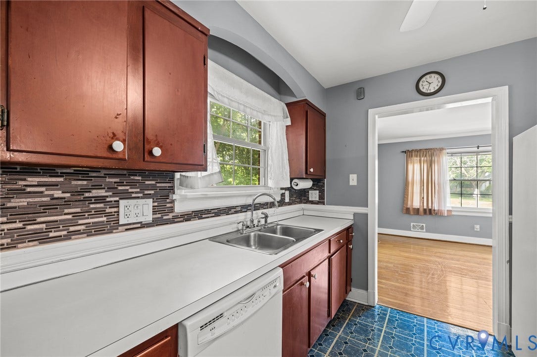 2405 Dumbarton Road, Henrico, VA 23228 White countertops, mosaic tile backsplash, double basin stainless steel sink, wood-finish cabinetry, and a dishwasher