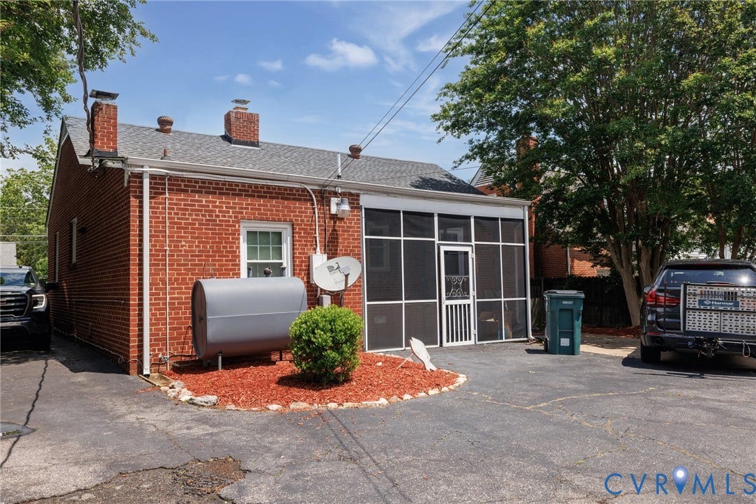 2405 Dumbarton Road, Henrico, VA 23228 Brick exterior with a screened-in porch and asphalt paving