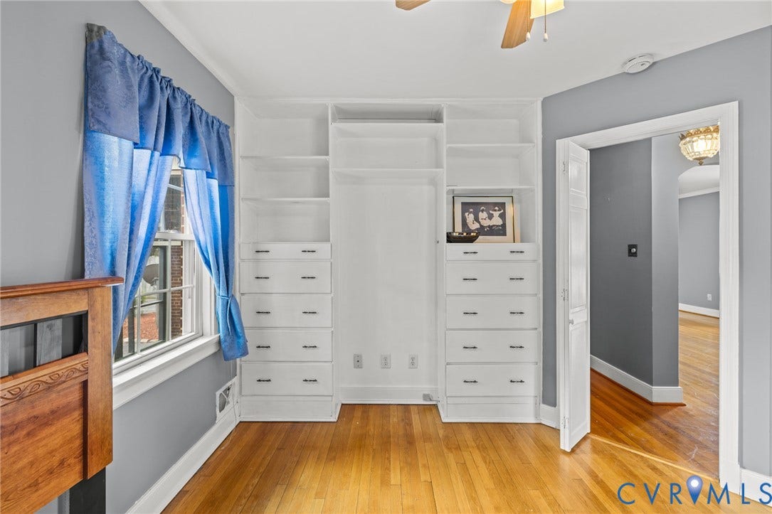 2405 Dumbarton Road, Henrico, VA 23228 Hardwood flooring throughout, built-in shelving with integrated drawers, and a ceiling fan with light fixture