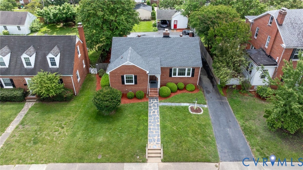 2405 Dumbarton Road, Henrico, VA 23228 Brick exterior featuring a gabled roof and white trim accents