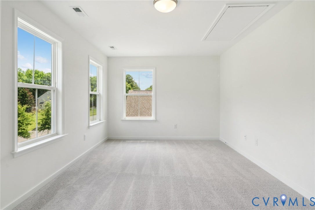 9116 TERROIR Lane, Viniterra Villas, New Kent, VA 23124 Wall-to-wall carpeting, multiple windows, ceiling-mounted light fixture, and attic access panel