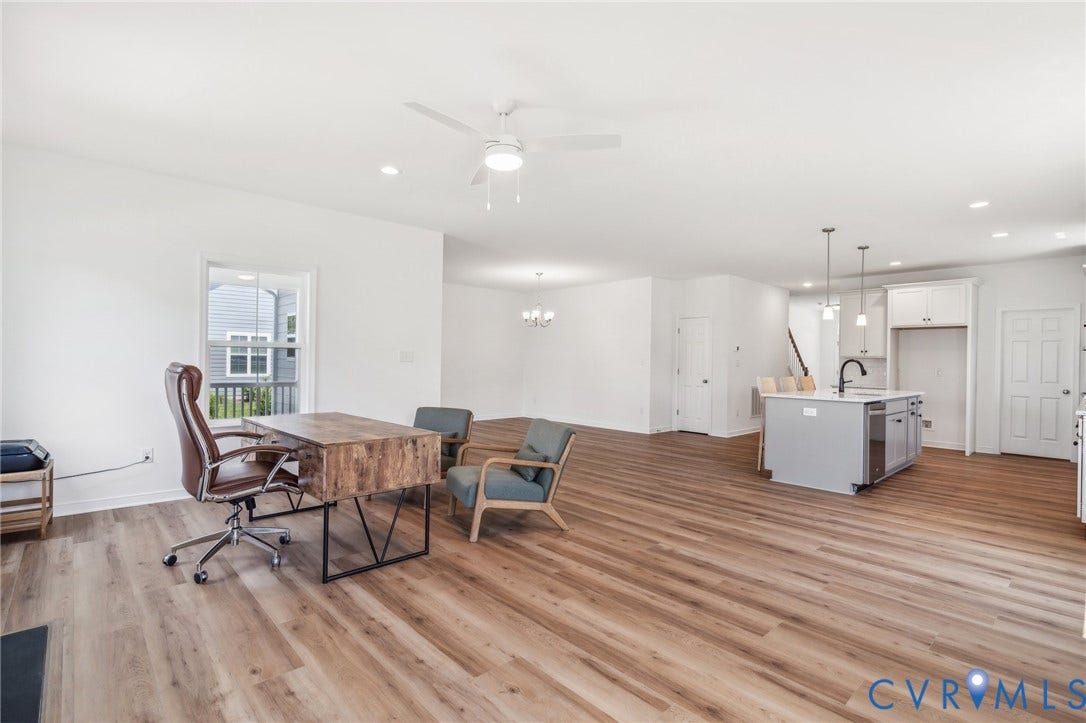 9116 TERROIR Lane, Viniterra Villas, New Kent, VA 23124 Open-concept living space with wood-finish flooring, recessed lighting, and a ceiling fan