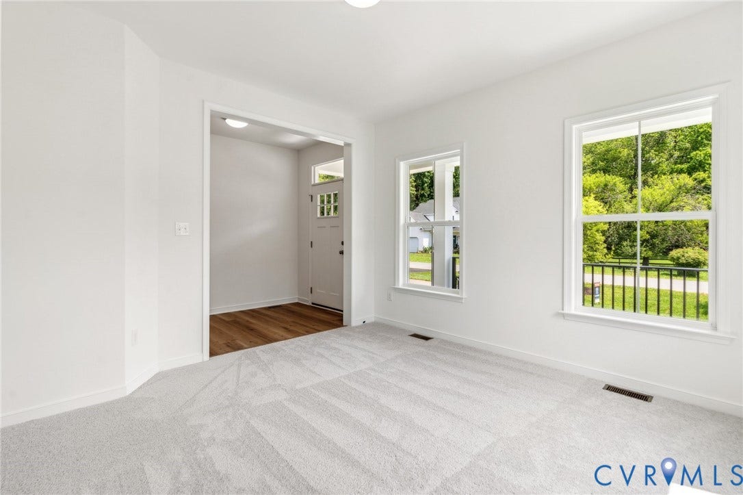 9116 TERROIR Lane, Viniterra Villas, New Kent, VA 23124 Bright interior with light gray carpeting, crisp white walls, and white trim