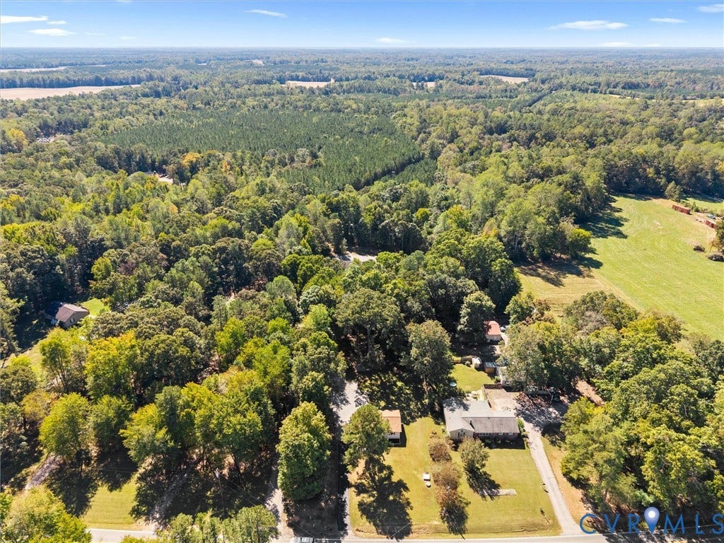 Expansive land parcel featuring a mix of mature trees, open clearings, and undeveloped natural areas