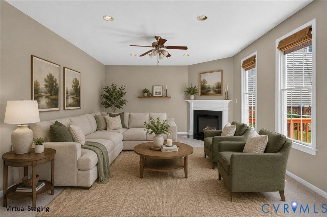 Spacious living area featuring a fireplace with a white mantel, ceiling fan, recessed lighting, and multiple windows