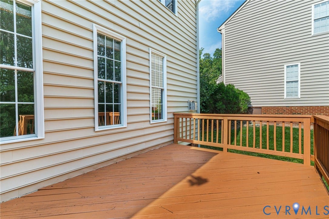 Exterior deck with wood railings