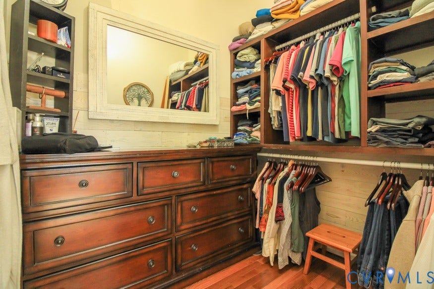 511 Riverview Court, Chester, VA 23836 Wood-finish flooring with built-in dark wood cabinetry and shelving