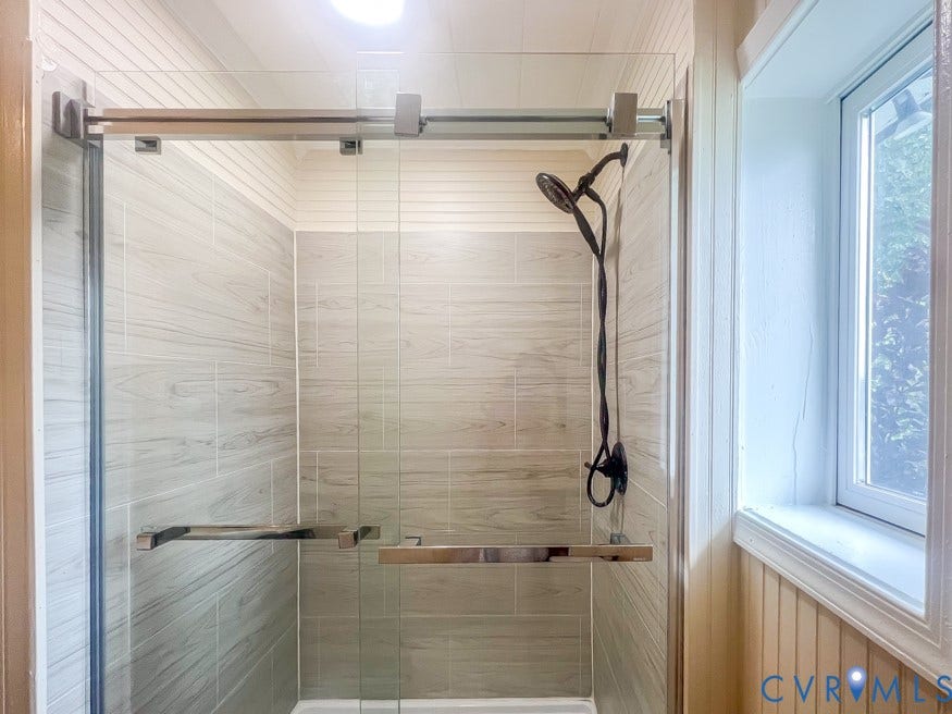 511 Riverview Court, Chester, VA 23836 Glass-enclosed shower with a handheld shower head, tile surround, and sliding door