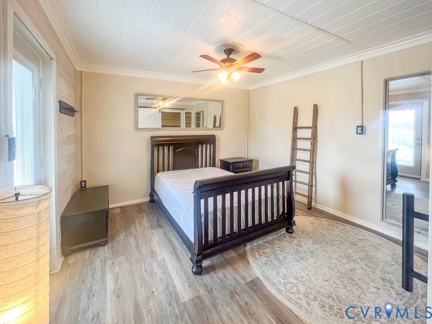 511 Riverview Court, Chester, VA 23836 Wood-finish flooring, white paneled ceiling, and a ceiling fan with light fixture