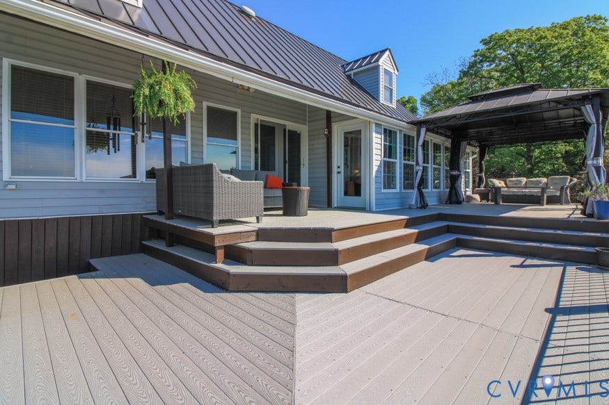 511 Riverview Court, Chester, VA 23836 Multi-level outdoor deck featuring light-toned composite decking, architectural steps, and a permanent covered gazebo structure