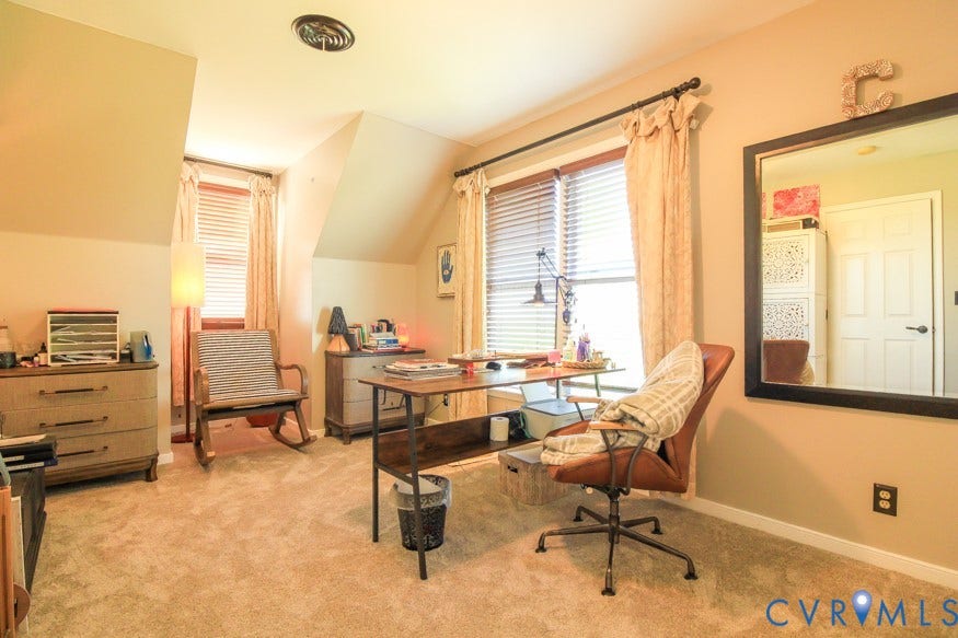 511 Riverview Court, Chester, VA 23836 Carpeted room featuring a sloped ceiling, window with blinds, and a built-in door