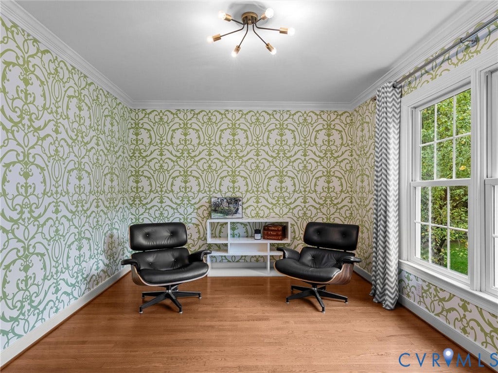 12100 English Ivy Lane, Glen Allen, VA 23059 Room featuring decorative patterned wallcoverings, multi-pane windows, wood-finish flooring, crown molding, and a modern multi-arm ceiling fixture
