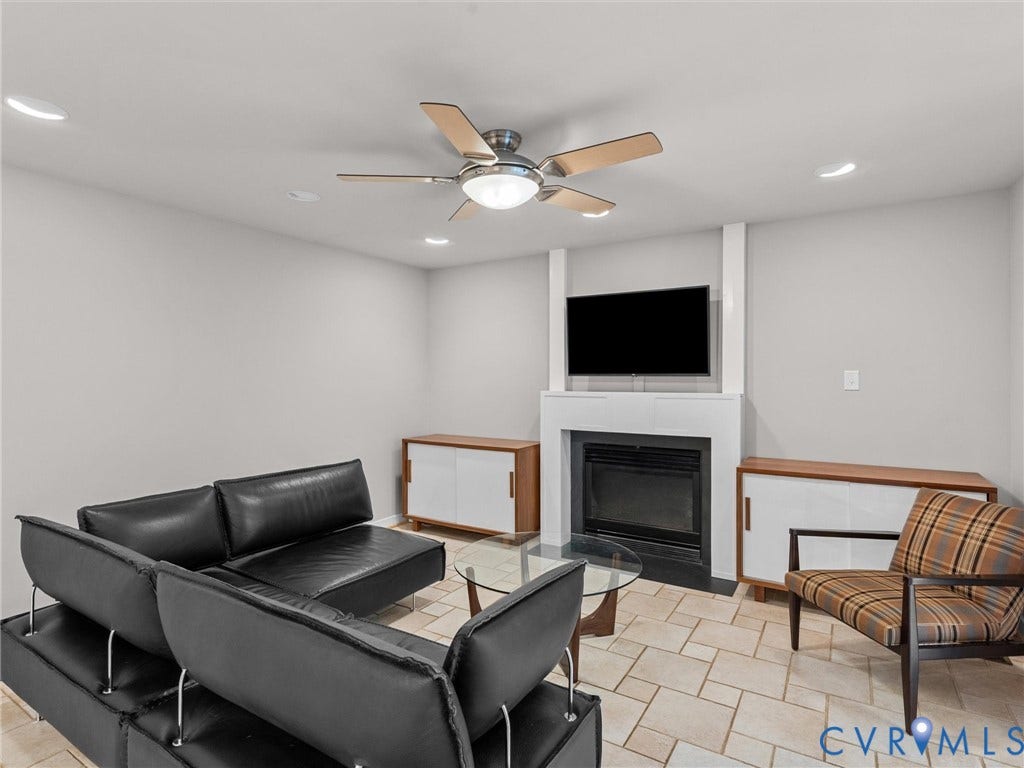 12100 English Ivy Lane, Glen Allen, VA 23059 Fireplace featuring a minimalist white surround, recessed lighting, ceiling fan, and tile flooring