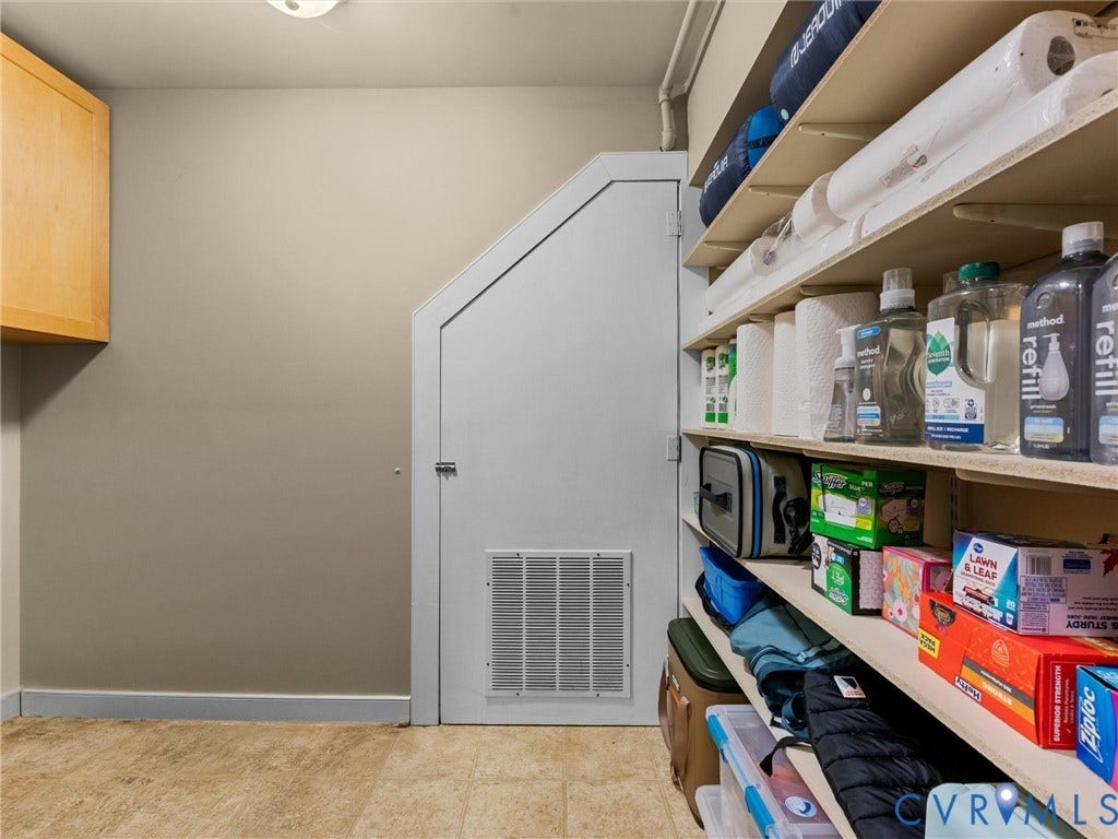 12100 English Ivy Lane, Glen Allen, VA 23059 Built-in wooden wall cabinetry and integrated tiered shelving units providing extensive storage capacity