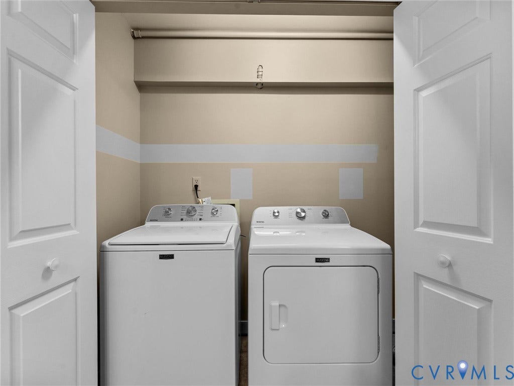 12100 English Ivy Lane, Glen Allen, VA 23059 Laundry closet featuring dual white paneled doors and a high-mounted storage shelf