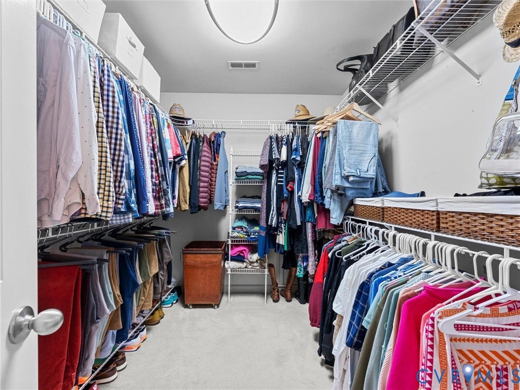 12100 English Ivy Lane, Glen Allen, VA 23059 Walk-in closet featuring multi-tiered wire shelving and integrated clothing rods