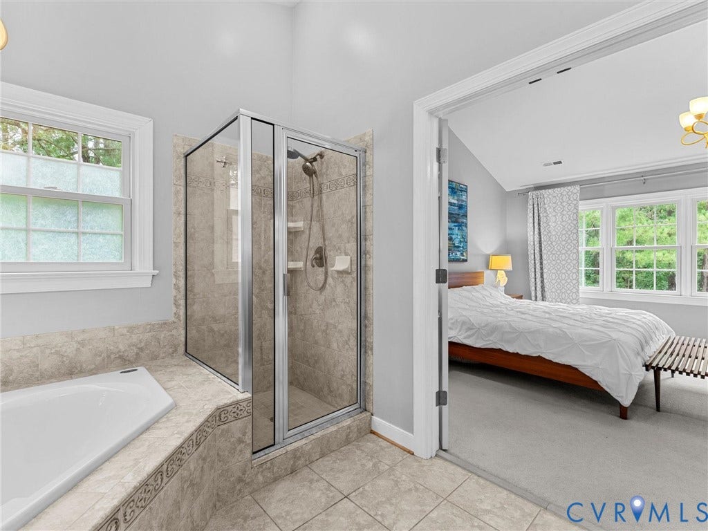 12100 English Ivy Lane, Glen Allen, VA 23059 Bathroom featuring a soaking tub, a glass-enclosed shower with tiled surround, and ceramic tile flooring