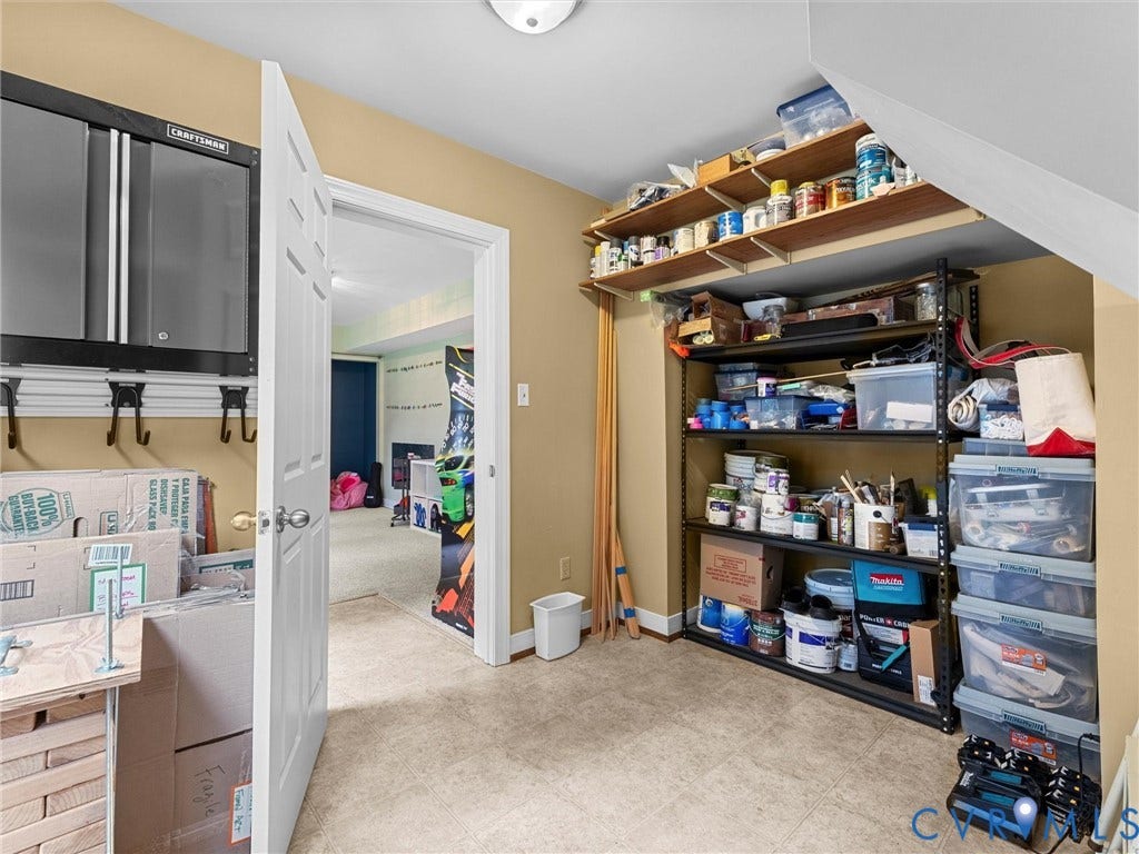 12100 English Ivy Lane, Glen Allen, VA 23059 Storage space featuring wall-mounted metal cabinetry, built-in shelving, and resilient tile flooring