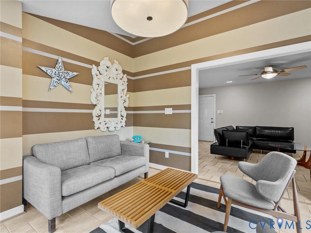 12100 English Ivy Lane, Glen Allen, VA 23059 Interior space featuring horizontal wall striping, a large circular dome-style overhead lighting fixture, and tile flooring throughout
