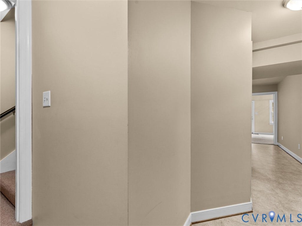 12100 English Ivy Lane, Glen Allen, VA 23059 Neutral wall finish with hard-surface flooring and carpeted stairwell with wall-mounted handrail