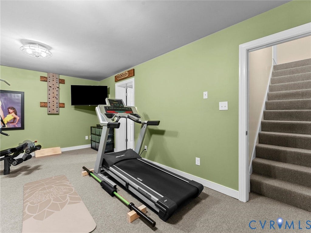 12100 English Ivy Lane, Glen Allen, VA 23059 Multi-purpose room featuring wall-to-wall carpeting, flush-mount ceiling lighting, and a staircase with carpeted treads